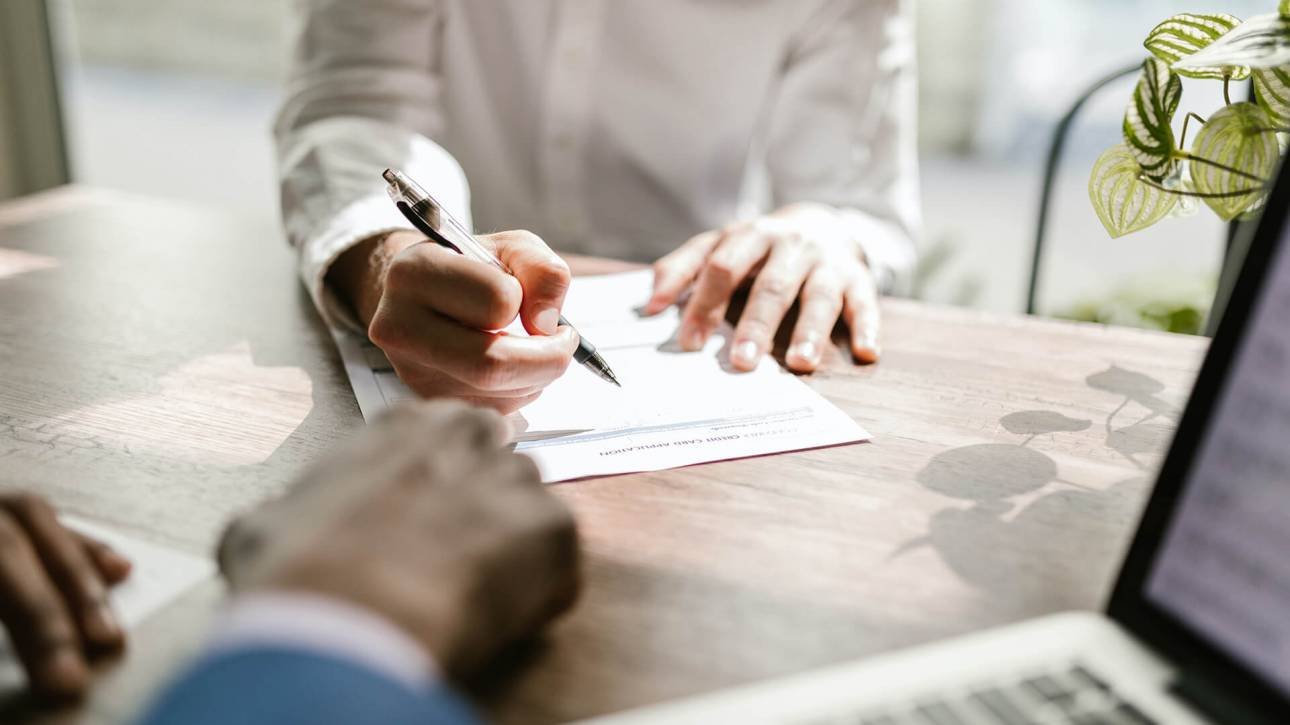 Small business owner and accountant reviewing documents